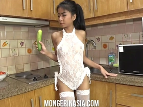Sexy thai whore fucks a cucumber